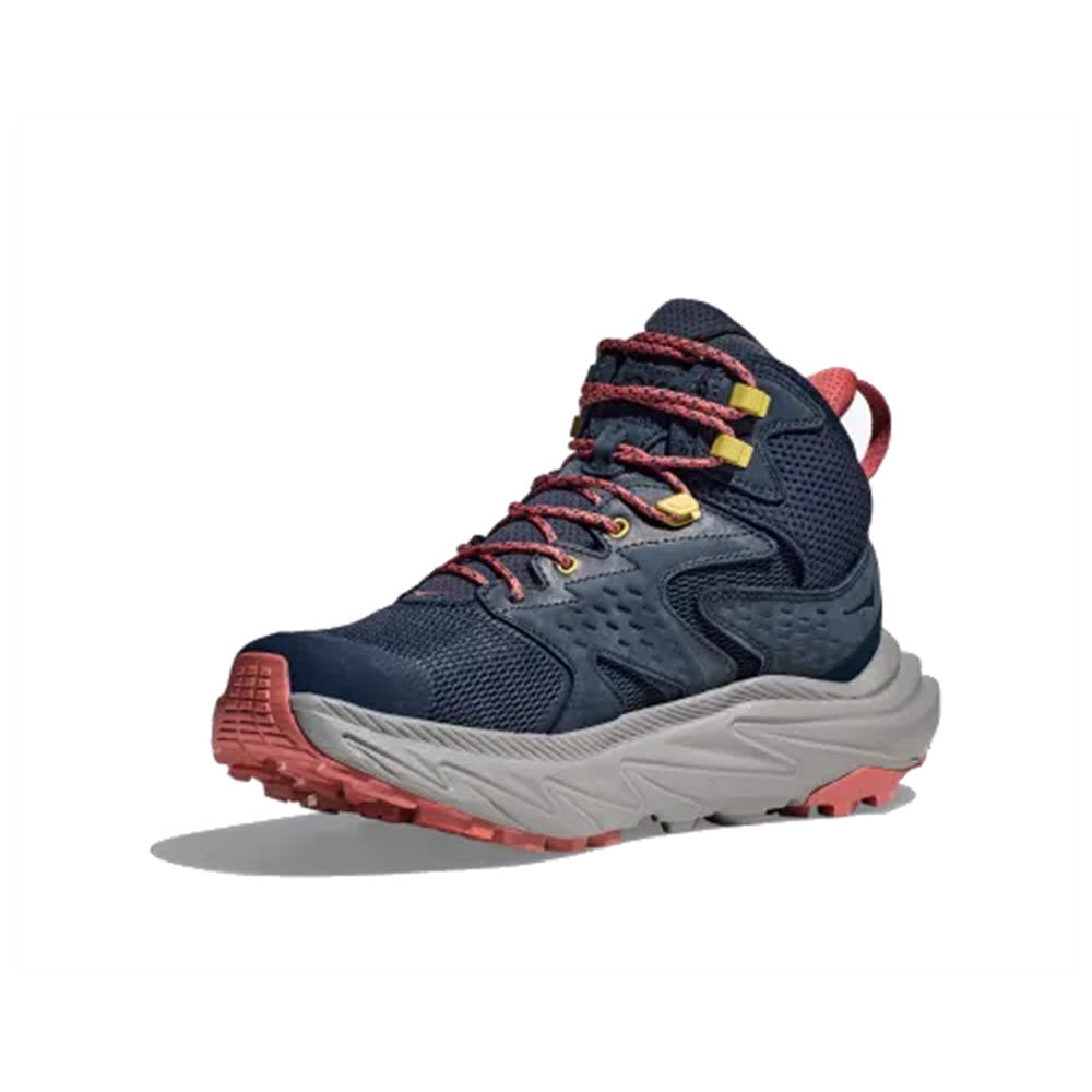 A navy blue and red Hoka hiking boot with yellow accents, featuring a thick grey sole and red tread, crafted from recycled materials. Product Name: HOKA ANACAPA 2 MID GTX OUTER SPACE/GREY - MENS.