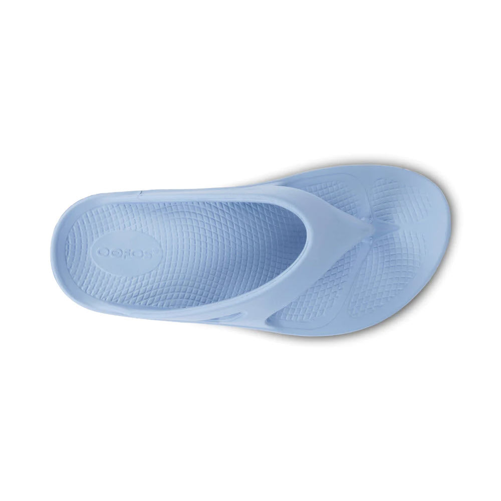 Light blue OOFOS OORIGINAL THONG NEPTUNE BLUE - WOMENS with a textured footbed featuring OOfoam technology and a toe post strap, viewed from above.