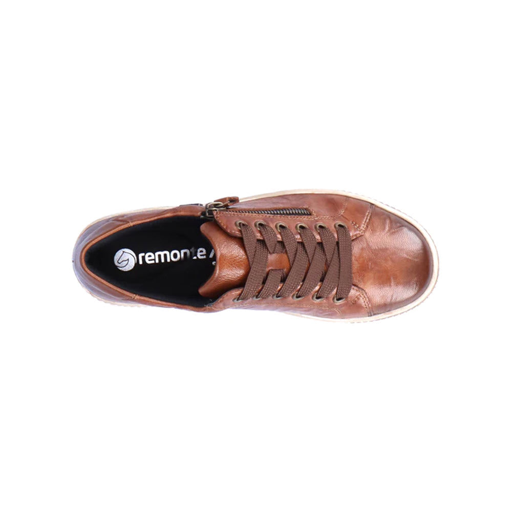 Top view of a brown leather sneaker with dark brown laces, a side zipper, and the Remonte brand logo on the insole. This waterproof design ensures durability and style. The product is REMONTE CITY WALKER TAN - WOMENS by Remonte.