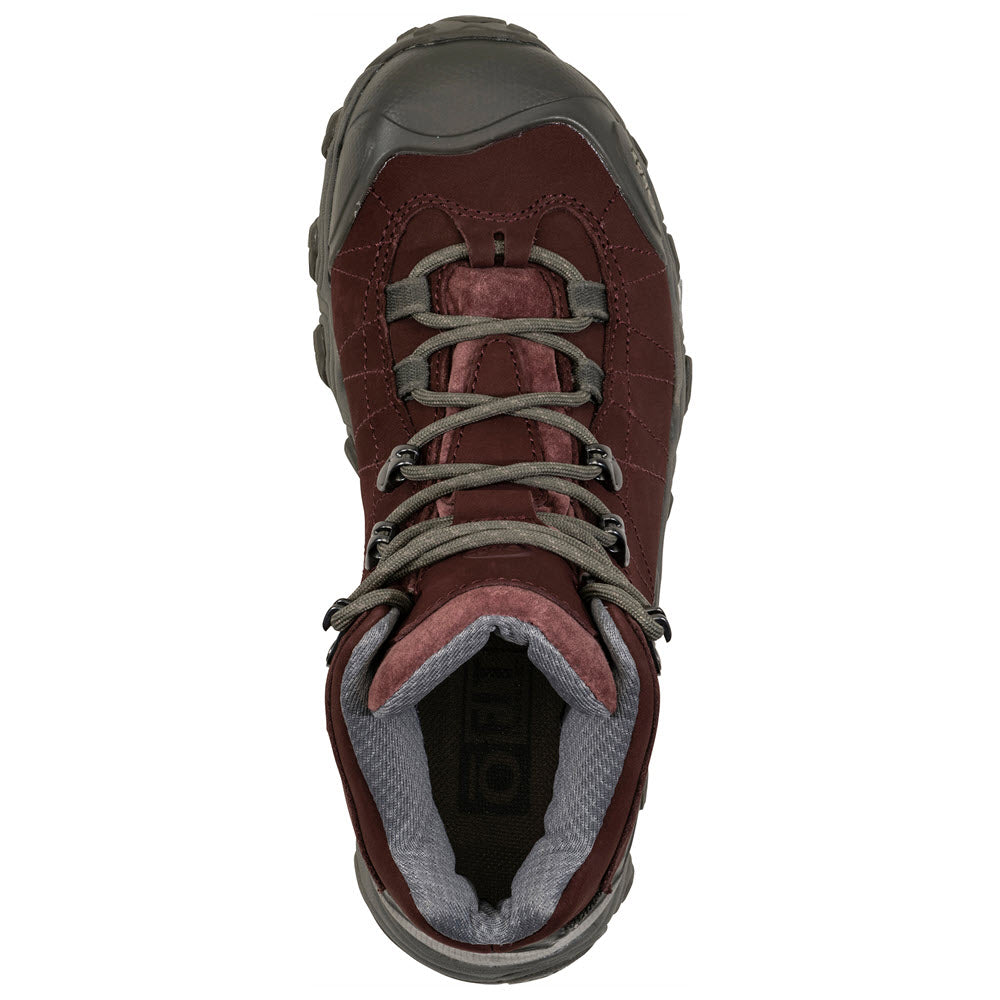 Top view of a single Oboz OBOZ BRIDGER MID B-DRY PORT - WOMENS hiking boot with a dark gray sole and gray laces, designed for exceptional trail performance.