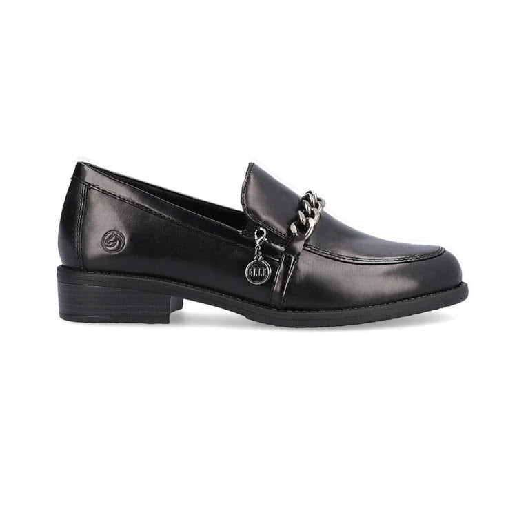 The REMONTE MODERN TAILORED LOAFER BLACK - WOMENS by Remonte is a black leather loafer with a low heel, featuring a metallic chain and a small charm, and also includes a removable insole for added comfort.