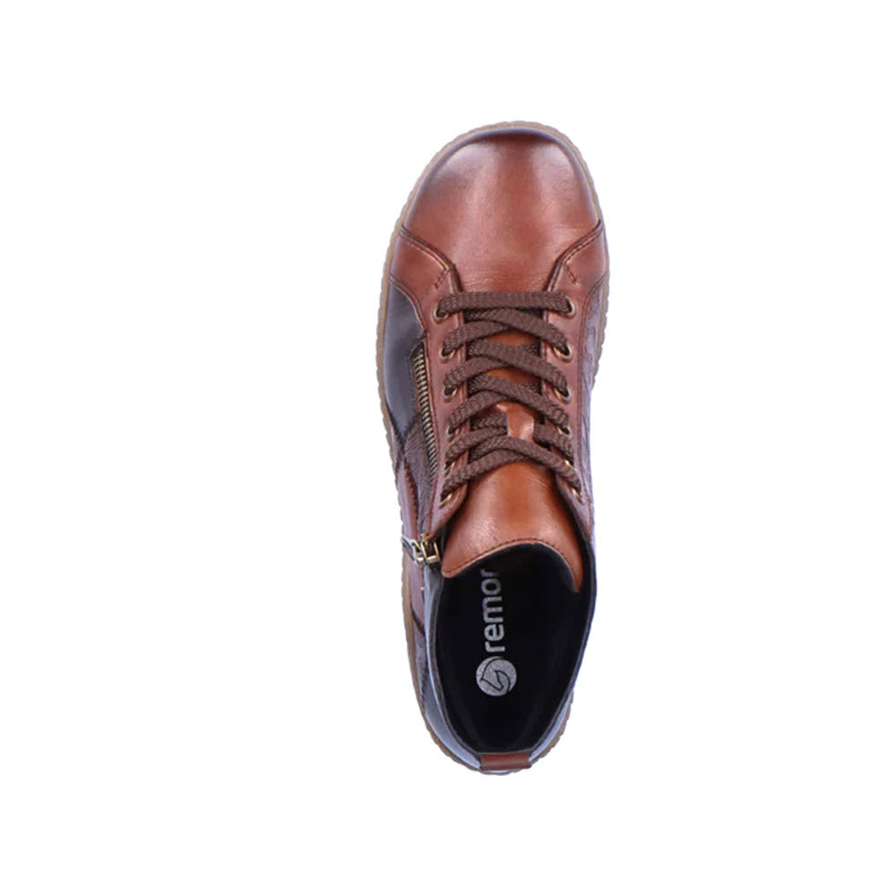 Top view of the REMONTE MIXED MATERIAL HIGH TOP CHESTNUT COMBI - WOMENS by Remonte, featuring a stylish brown leather lace-up design with matching brown laces, a side zipper, and the word &quot;remonte&quot; on the insole. This boot is equipped with a durable TR rubber outsole for added durability and traction.