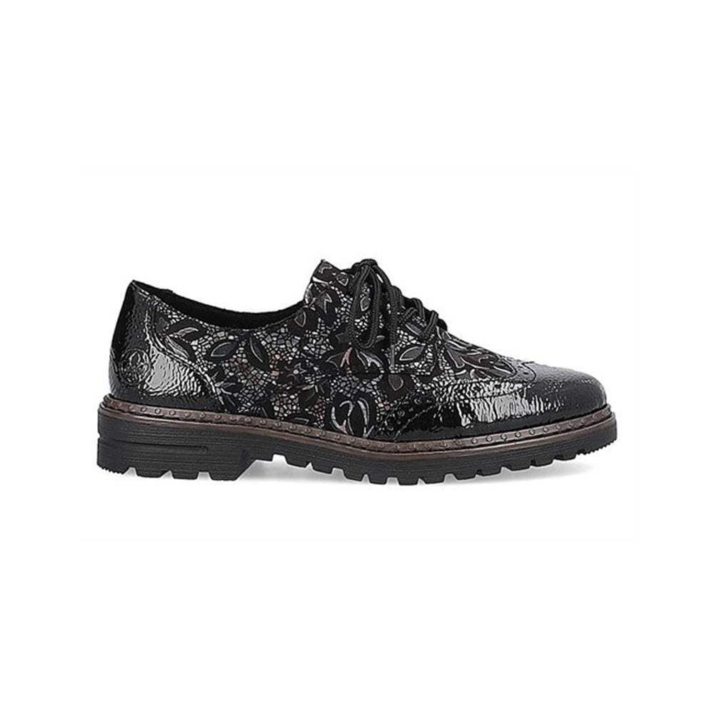 The Rieker Modern Tailored Brogue Black Meta Women&#39;s shoe by Rieker boasts a black lace-up design with a textured, floral pattern and a thick, rugged sole. These leather brogues also feature anti-stress insoles for all-day comfort.