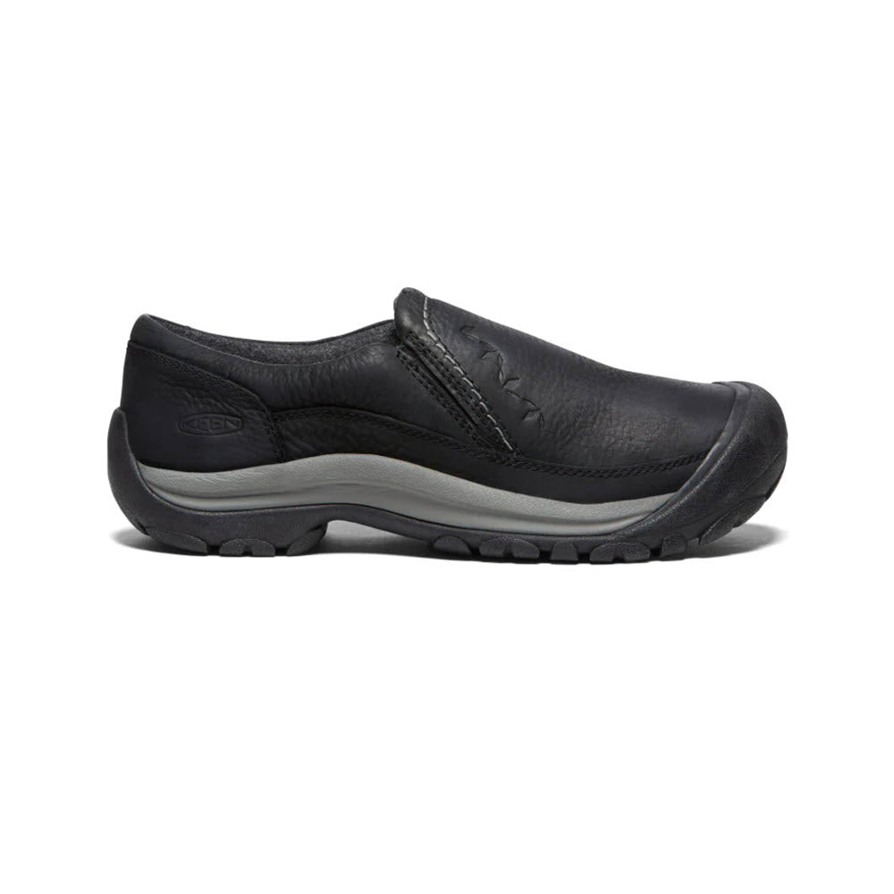 The KEEN KACI II Winter Slip-On for women, in black, features a rounded toe, leather upper, grey midsole, and rugged rubber outsole that offers warmth and waterproofing.