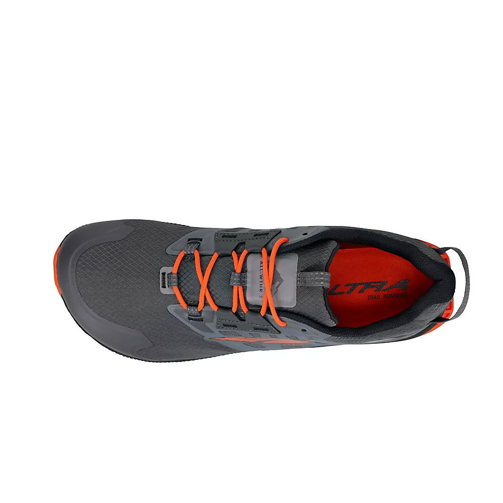 Top view of an ALTRA LONE PEAK ALL-WTHR ATR 7 GRAY/ORANGE - MENS with orange laces. The interior, highlighted with an orange lining, features a lightweight bootie design, and the Altra logo is visible on the insole.