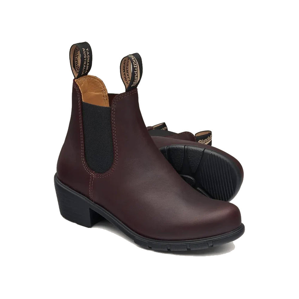 A pair of fashion-forward Blundstone BLUNDSTONE WOMENS HEEL SHIRAZ - WOMENS boots with pull tabs and elastic side panels, displayed against a white background.