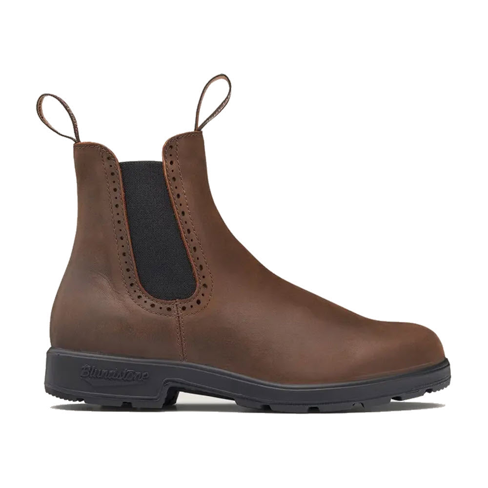 The Blundstone BLUNDSTONE 2151 HIGH TOP ANTIQUE BROWN - WOMENS boot is made of antique brown leather, featuring dual pull tabs, elastic side panels, stitched detailing, and a black rubber sole for comfort and durability.