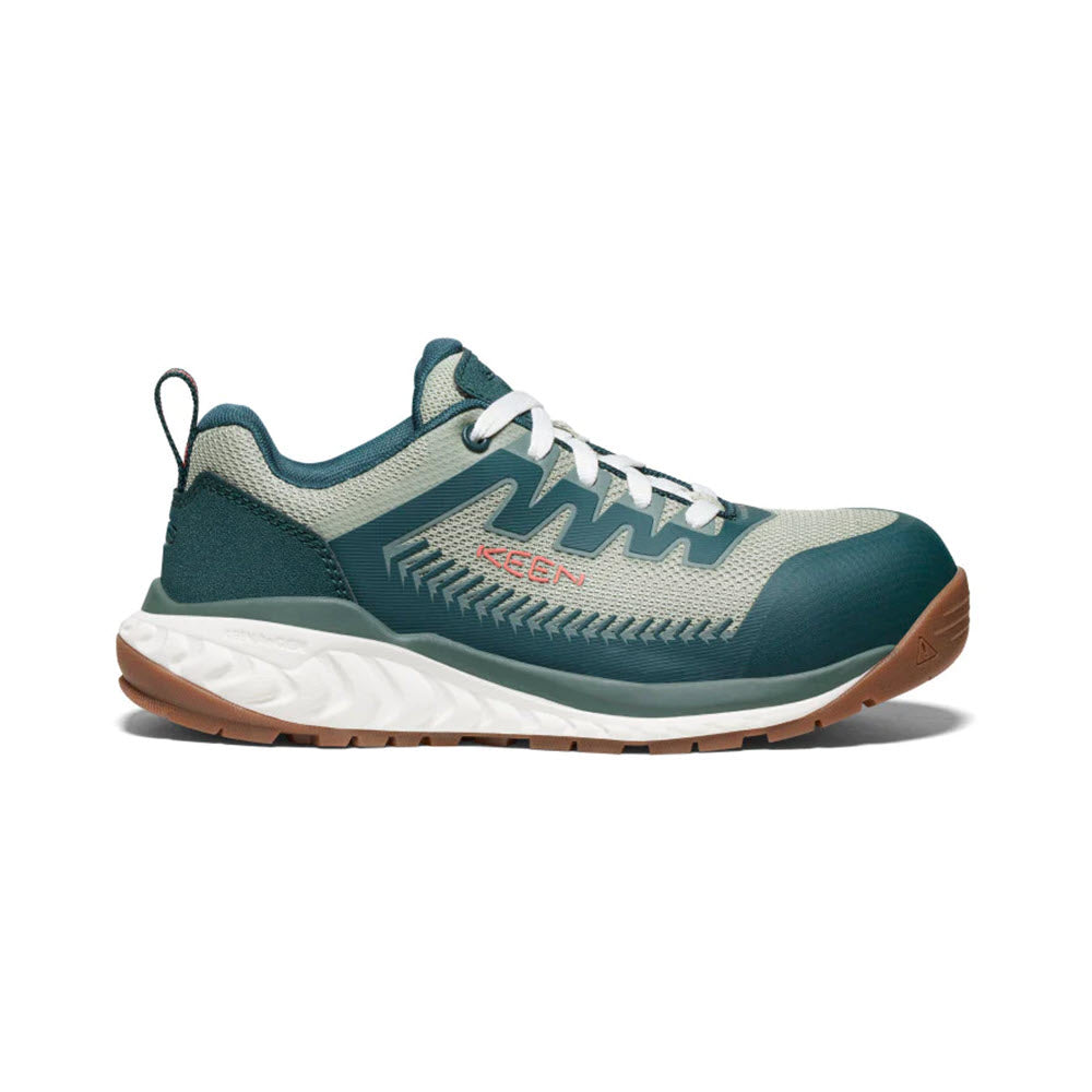 A single teal and gray women's work sneaker with white laces and orange accents on a white background. The shoe features energy-returning cushioning with a thick, white and brown sole, ensuring comfort throughout the day. This is the KEEN CT ARVADA LOW SEA MOSS/DESERT SAGE - WOMENS by Keen.