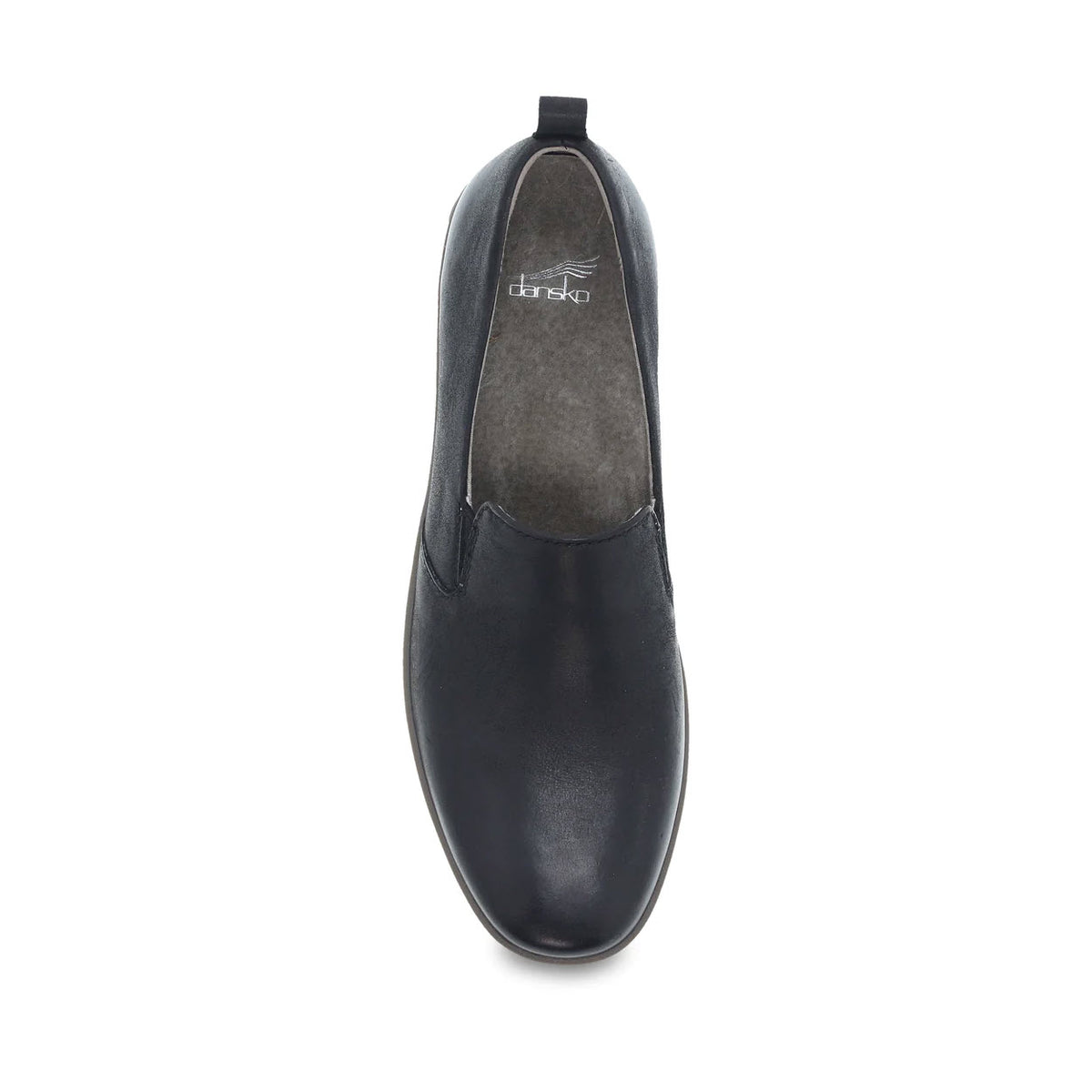 Top view of the Dansko Linley Black Burnished slip-on shoe, showcasing a grey insole, buttery soft leathers, and a small pull tab at the heel.