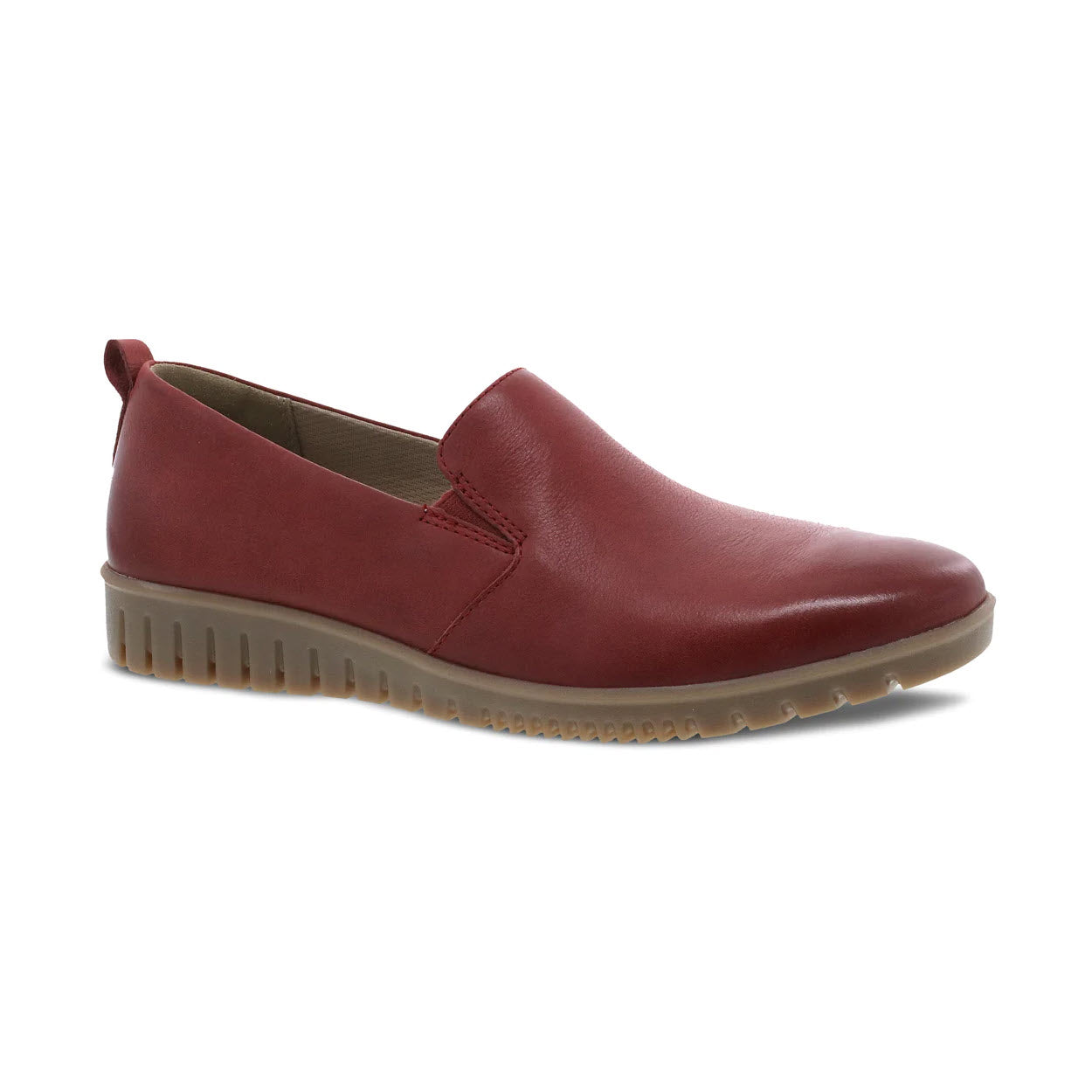 The DANSKO LINLEY RED BURNISHED - WOMENS by Dansko is a red slip-on shoe featuring a brown rubber sole and subtle side stitching, crafted from buttery soft leathers for ultimate comfort.