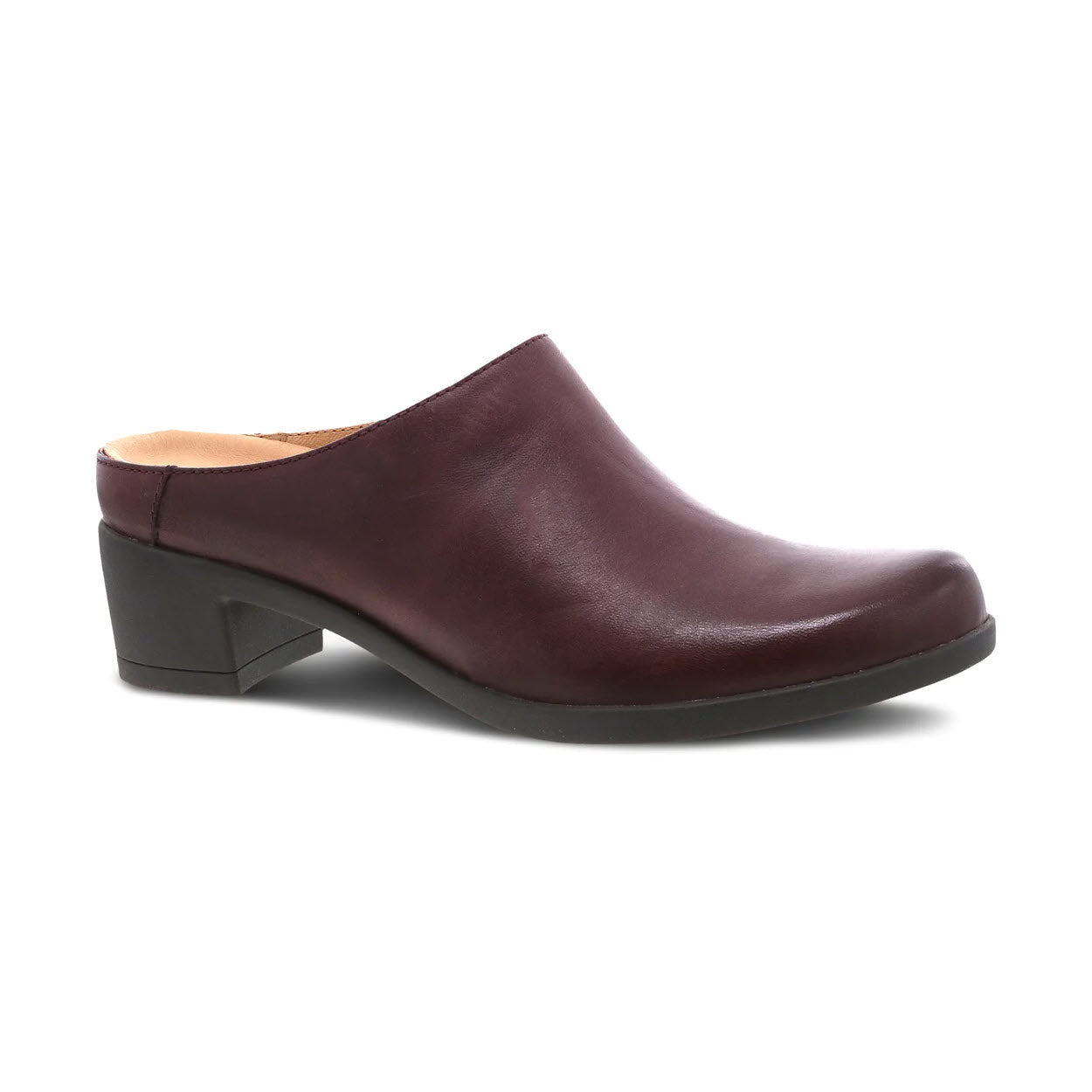 The DANSKO CARRIE WINE BURNISHED for women is a dark brown backless mule with a low block heel and closed toe, featuring Dansko Natural Arch® technology for added comfort.