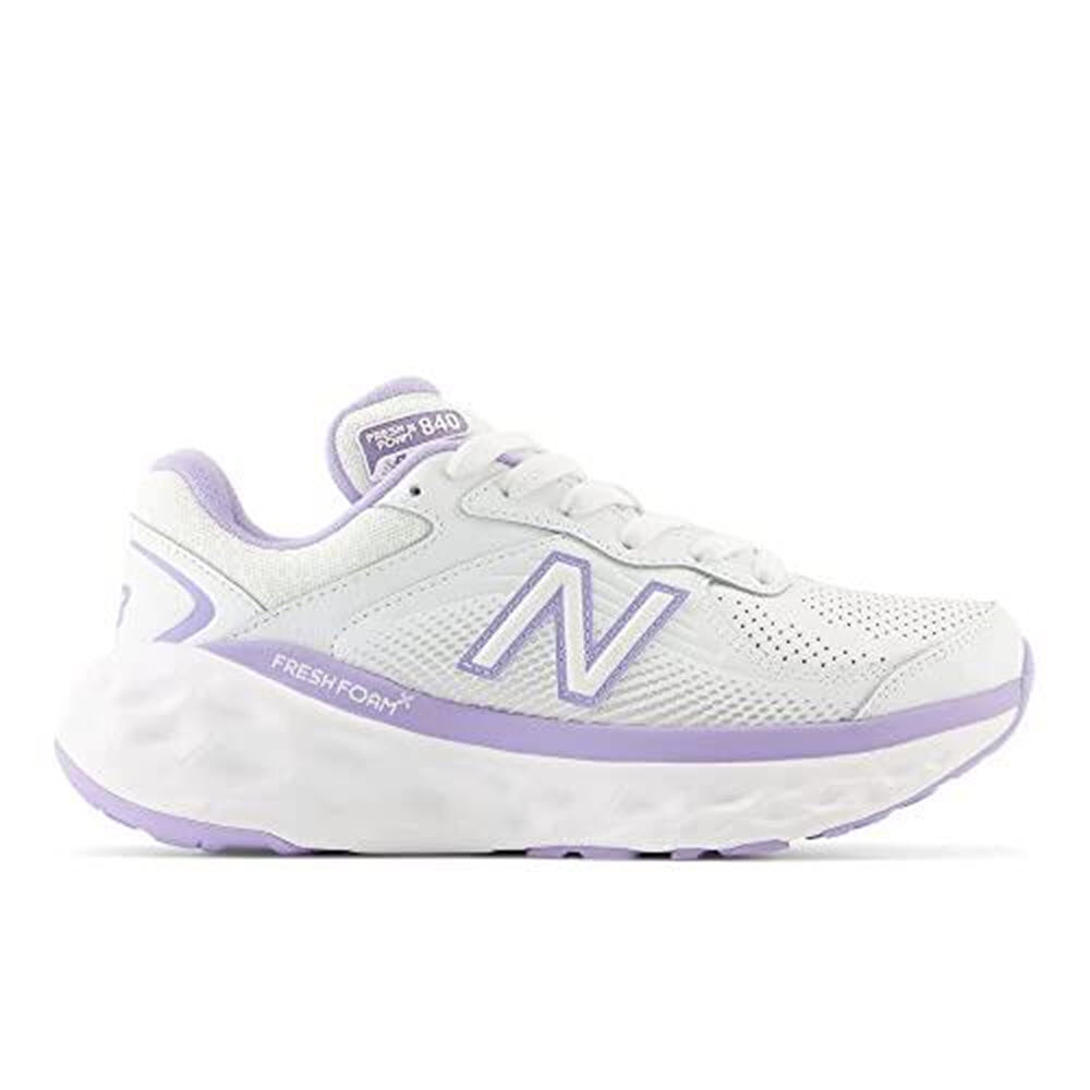 Side view of a NEW BALANCE FRESH FOAM X 840F WHITE/LILAC - WOMENS athletic shoe, showcasing white and lilac color accents, exceptional cushioning, a thick sole, and the New Balance logo on the side, tongue, and heel.