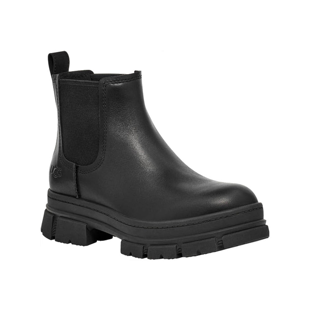 The UGG ASHTON CHELSEA BLACK for women by Ugg features a versatile silhouette in black leather, complete with chunky treaded sole and elastic side panels.