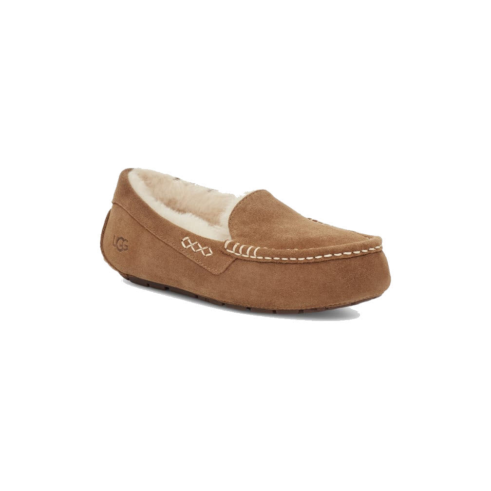 A UGG ANSLEY CHESTNUT - WOMENS by Ugg with white stitching and a cozy wool lining is displayed at a slight angle, showing the left side and front. Perfect for indoor and outdoor wear, these slippers combine comfort with versatility.