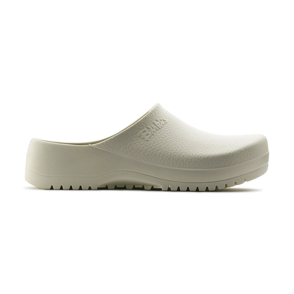 A side view of a single white slip-on clog with a textured surface and the Birkenstock brand name embossed near the top. This versatile footwear features a closed toe, ridged sole for grip, and water-resistant properties, making it an ideal kitchen clog. The product is known as the BIRKENSTOCK SUPER BIRKI WHITE - ADULTS.