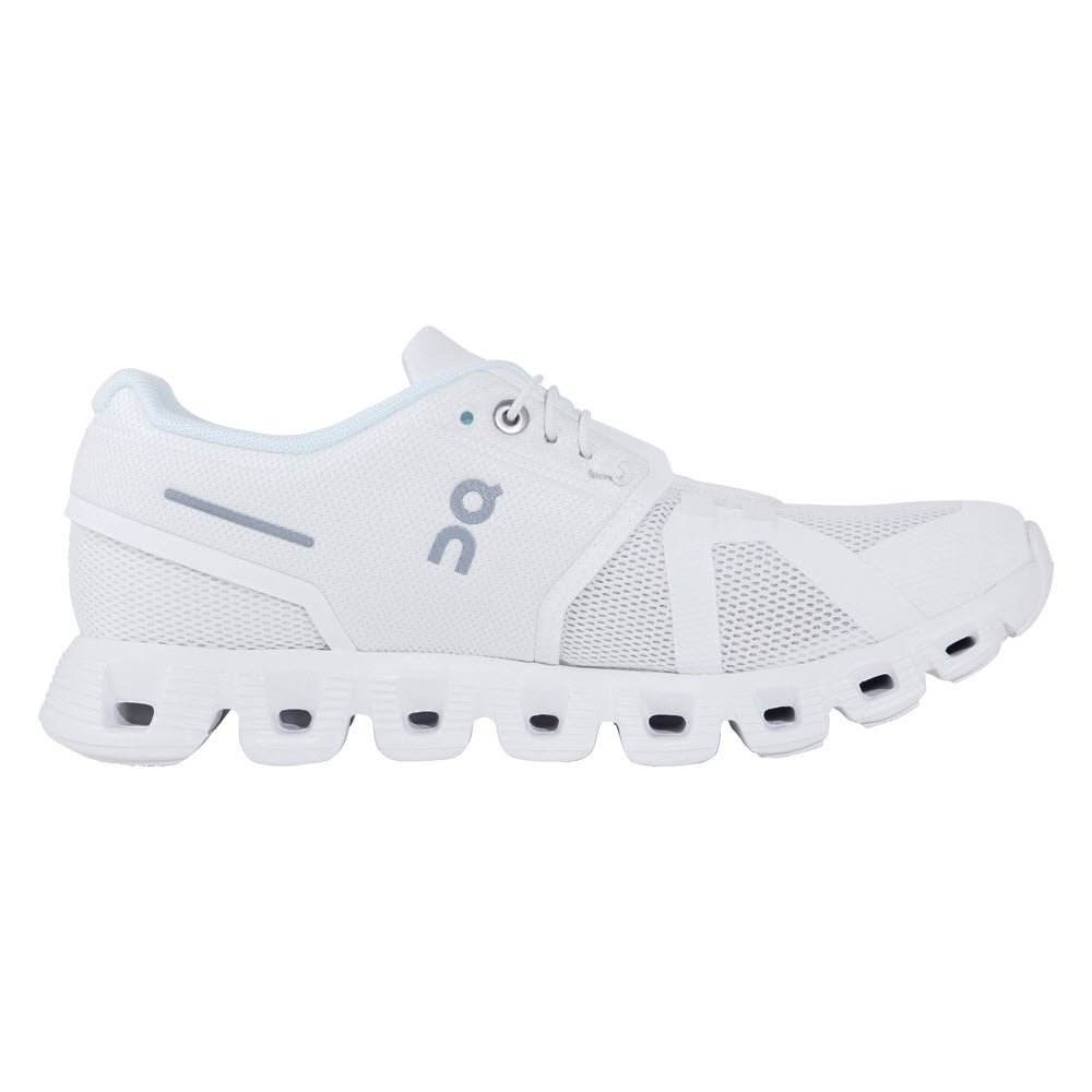 A white athletic shoe featuring a mesh upper, lace-up closure, and distinct sole design with multiple oval-shaped cutouts for more comfort and improved fit is the ON RUNNING CLOUD 5 UNDYED WHITE - WOMENS by On Running.