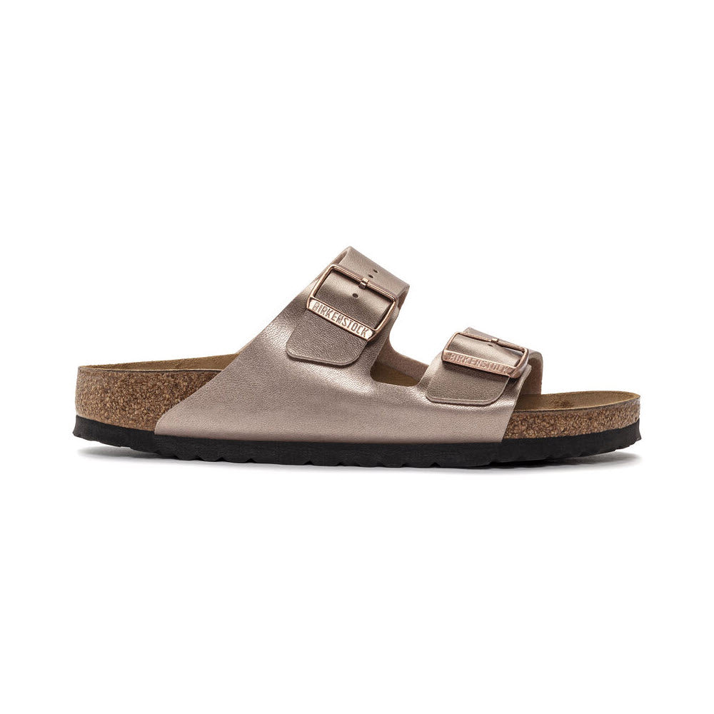 Side view of a Birkenstock BIRKENSTOCK ARIZONA METALLIC COPPER BIRKOFLOR - WOMENS in metallic brown with two adjustable straps and a contoured cork-latex footbed on a black sole.