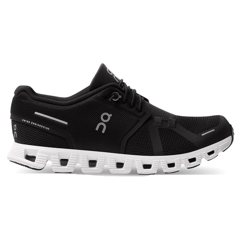 A black On Running shoe with a CloudTec® sole and speed-lacing system, adorned with Swiss engineering branding.