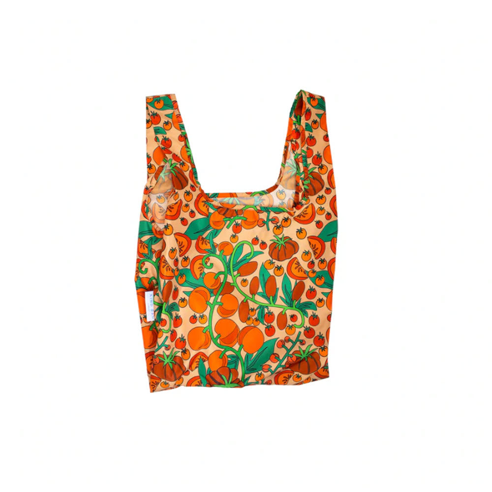 A lightweight, reusable KIND MEDIUM SHOPPER BAG TOMATOES adorned with a bright orange and green citrus fruit pattern on a light orange background, crafted from recycled materials by KIND BAGS.