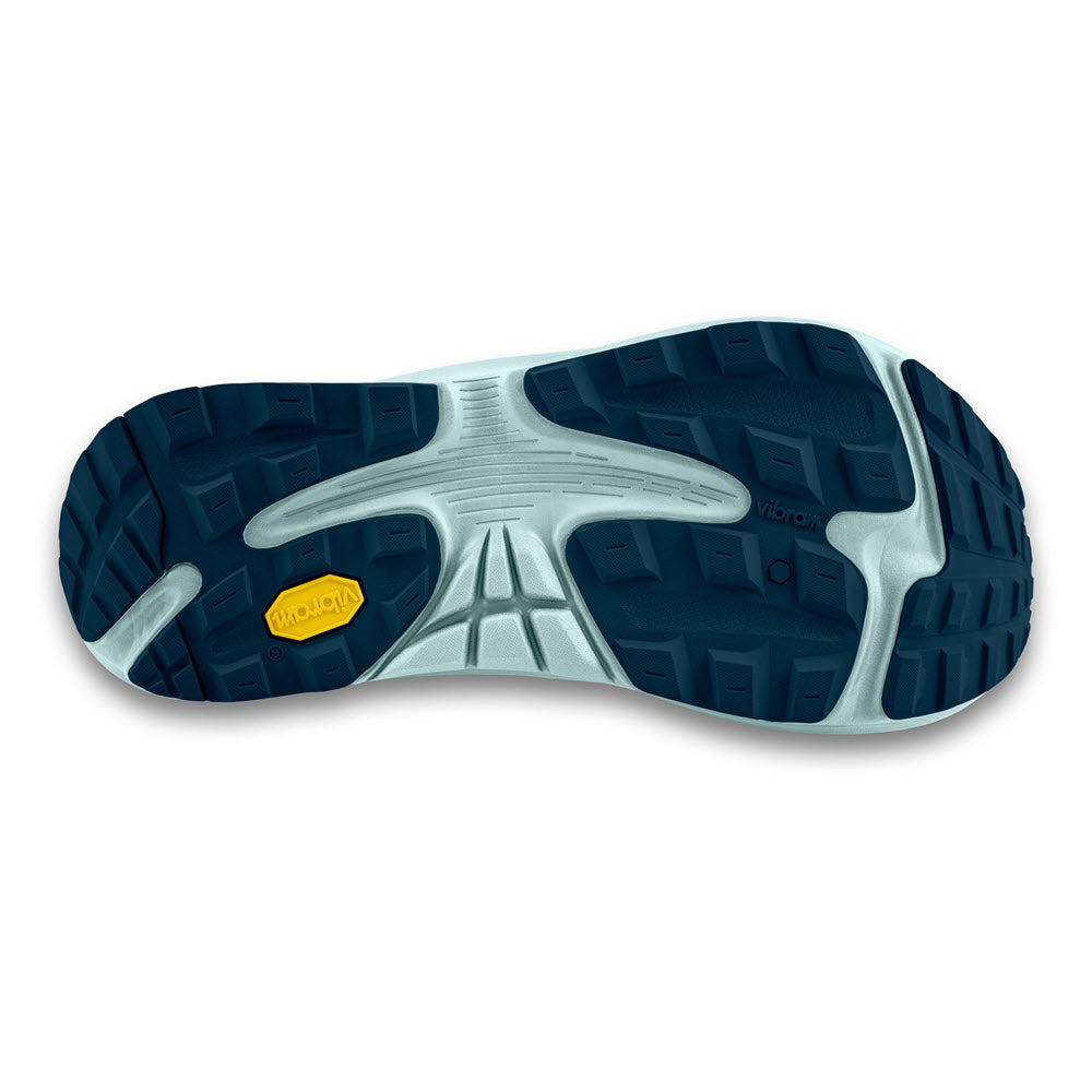 The image shows the sole of a TOPO Ultraventure 3 Navy/Blue shoe (Women&#39;s) with deep blue treads, a small yellow marking near the heel, and a cushioned platform featuring Vibram® XS Trek EVO technology.