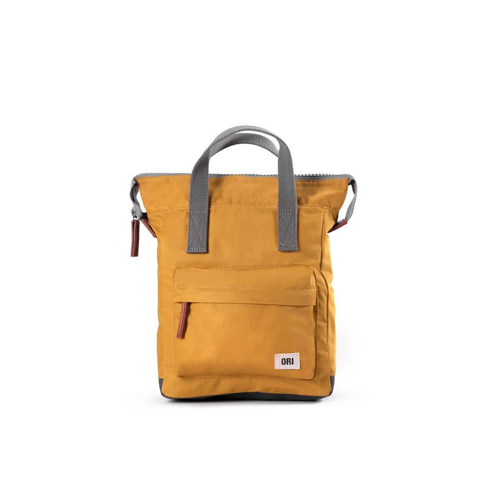 An Ori London ORI LONDON BANTRY B NYLON SMALL PACK CORN with gray handles, a front zippered pocket, and a secure laptop sleeve for added convenience.