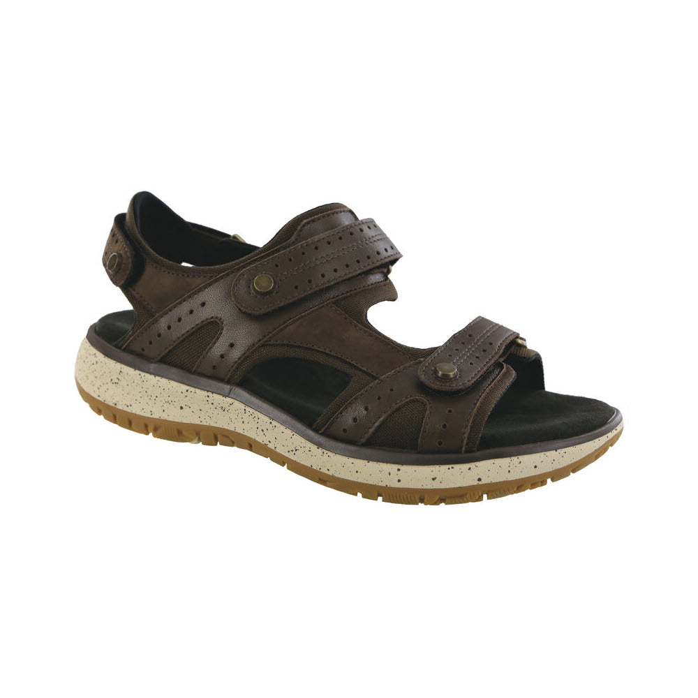 A SAS EMBARK SMORES - WOMENS brown leather, outdoorsy sandal featuring adjustable straps and a cushioned, speckled white and brown sole.