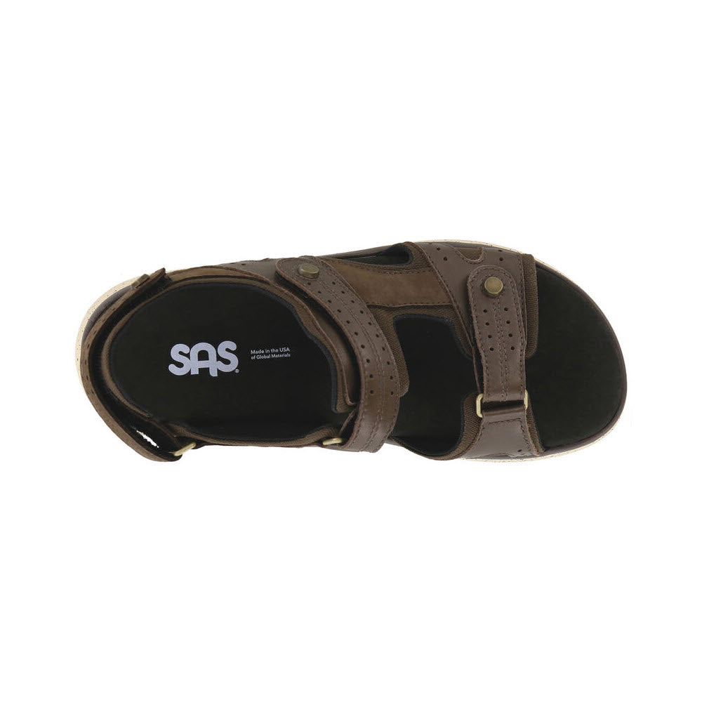 Top view of an outdoorsy sandal with adjustable straps and buckle closures. The cushioned insole features the SAS logo. The product is the SAS EMBARK SMORES - WOMENS by SAS.