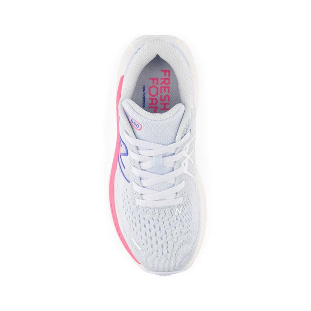 Top view of a white athletic shoe with pink and blue accents, featuring the product name &quot;NEW BALANCE 860 V13 MOON DUST/NEON PINK - KIDS&quot; and the brand name &quot;New Balance&quot; on the insole and a lace-up closure.