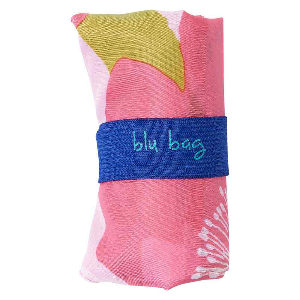 A rolled-up, eco-friendly shopping bag with a pink floral pattern and a blue band labeled &quot;BLU BAG POPPIES,&quot; boasting a compact size for easy storage by Rockflowerpaper.