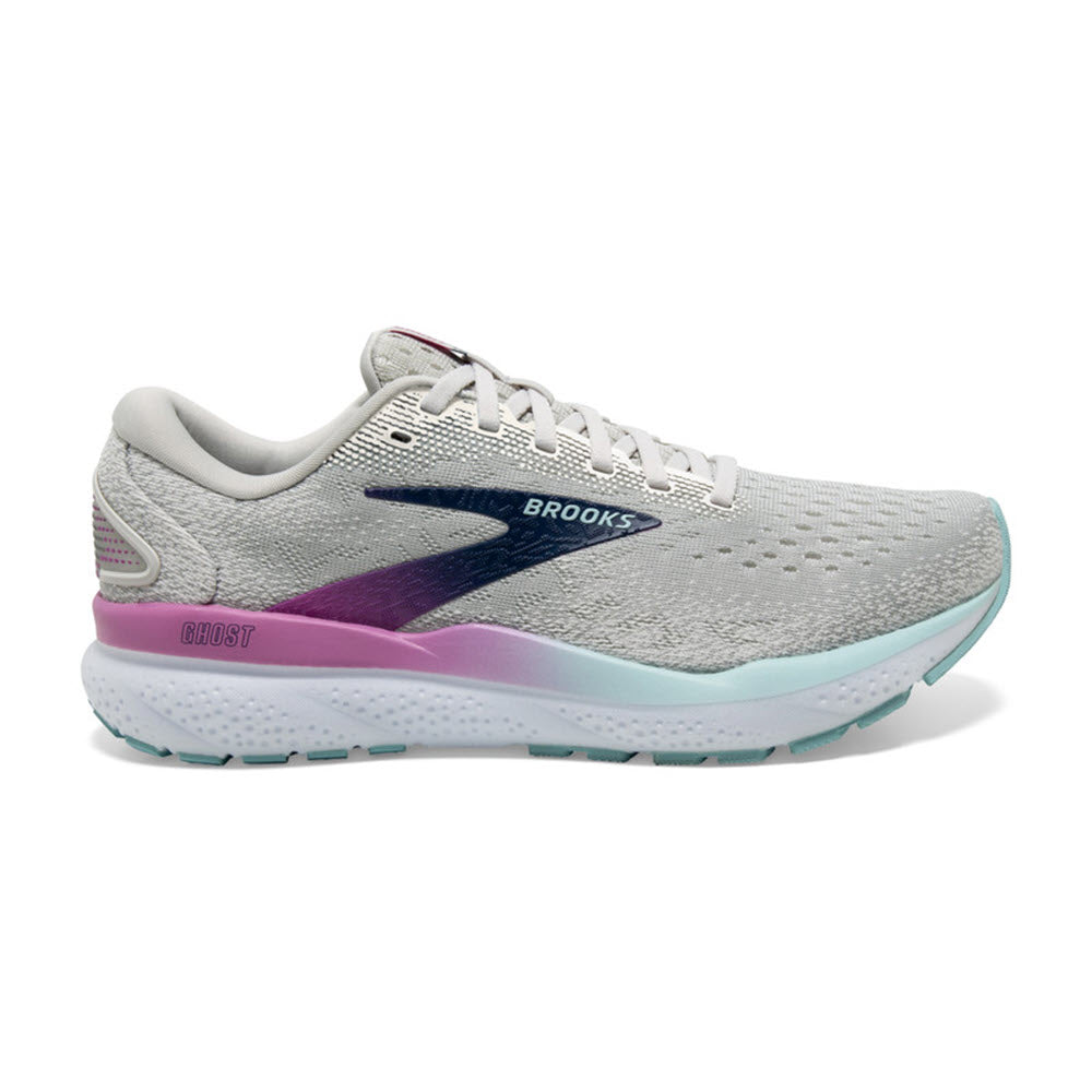 A side view of the Brooks Ghost 16 Women&#39;s athletic shoe in White, Grey, and Estate Blue features the &quot;Brooks&quot; logo on the side and showcases stylish purple and light blue accents on the sole and heel. This well-cushioned daily trainer promises both comfort and style for your everyday runs.