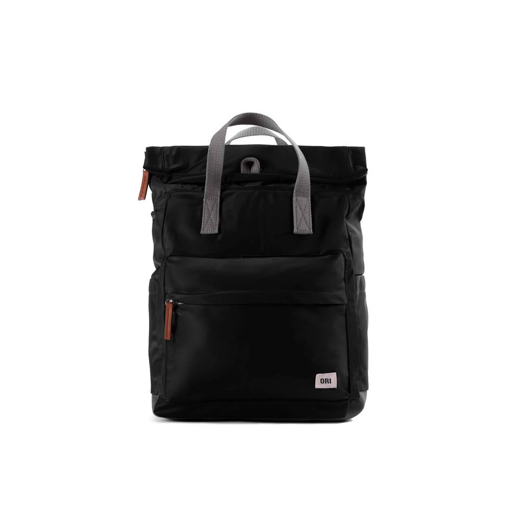 A practical backpack by Ori London, the ORI LONDON CANFIELD B MD BACKPACK BLACK features gray handles and zipper details, along with a front pocket adorned with a small white logo tag.