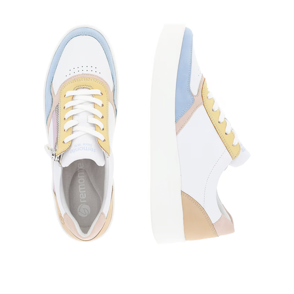 A pair of Remonte Euro Court Sneaker Pastel Multi for women, featuring low-top design and a smooth leather finish. These sneakers showcase multicolored pastel panels in blue, yellow, and beige. One shoe is displayed from the top and the other from the side, highlighting their white laces, thick white soles, and Lite &#39;n Soft technology for added comfort.