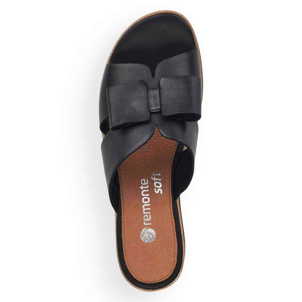 A single black REMONTE BOW WEDGE SANDAL BLACK - WOMENS by Remonte featuring an open toe design with a cute bow detail on top, cushioned insole, and a flat sole.