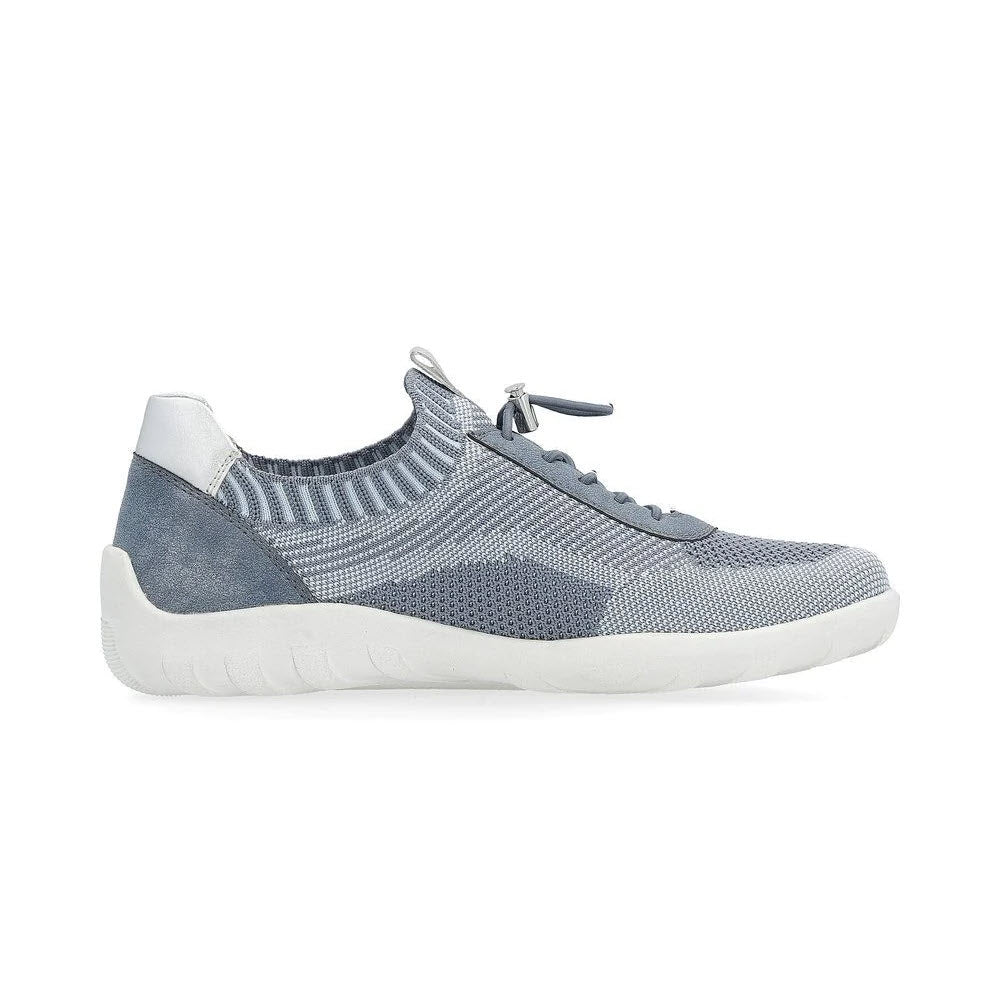 Introducing the REMONTE LITE &amp; SOFT SNEAKER DENIM for women by Remonte. This light blue and grey athletic sneaker features a knit upper, white sole, and lace-up closure, making it perfect for casual wear. Combining style and comfort in one sleek design, this versatile walking shoe is ideal for your everyday adventures.