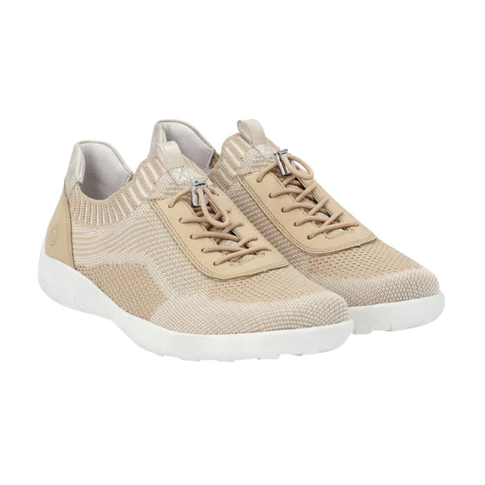 A pair of light beige knitted sneakers with white soles and elastic band laces is displayed against a white background, showcasing their REMONTE LITE &amp; SOFT SNEAKER VANILLA - WOMENS comfort by Remonte.
