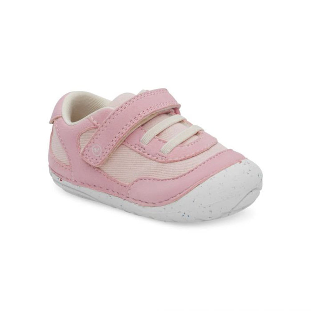 A single pink toddler shoe with a white rubber sole, white laces, and a hook-and-loop strap features an easy-on design for convenience is the Stride Rite STIRDE RITE SM SPROUT PINK - KIDS.