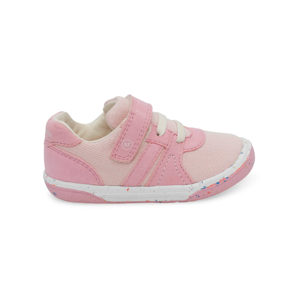 A pink shoe with a white sole, crafted as part of our sustainable sneakers collection, the STRIDE RITE SR FERN PINK - KIDS by Stride Rite.