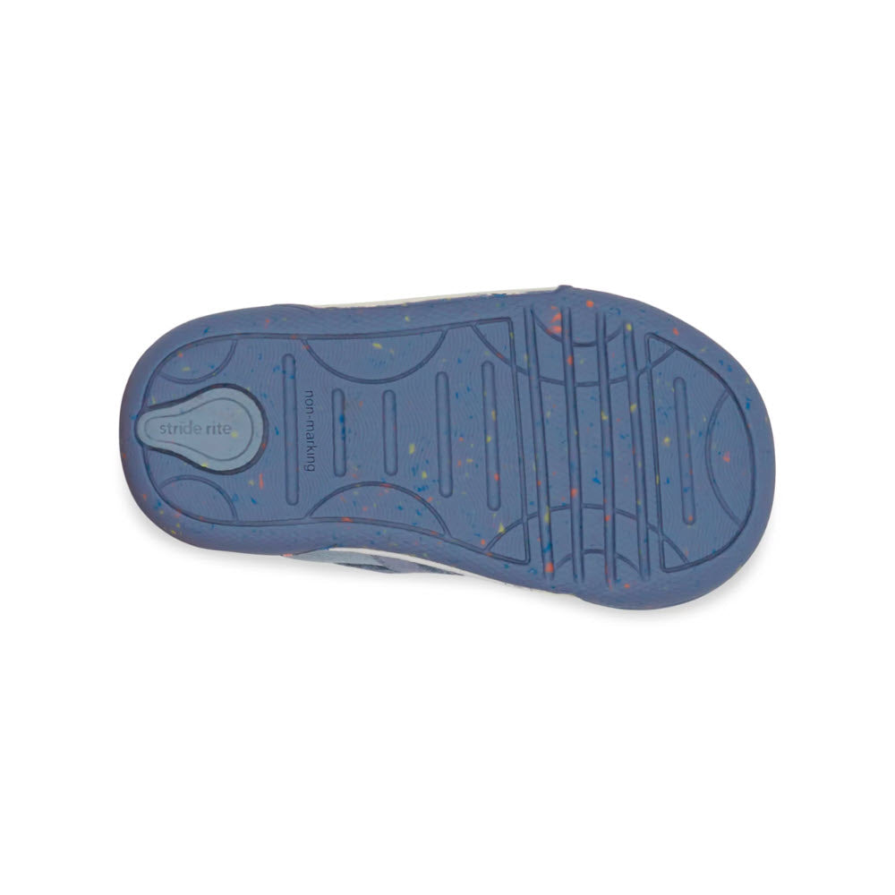 Bottom view of a blue children&#39;s shoe, identified as STRIDE RITE SR FERN BLUE - KIDS, with a textured sole and Stride Rite branding. The sole features multicolored specks, various grooves for traction, and is crafted from eco-friendly materials such as seaweed fiber.