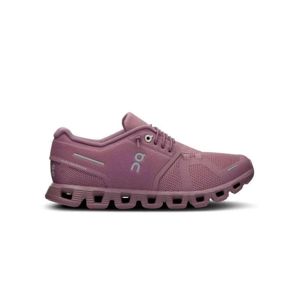 Side view of a single On Running ON CLOUD 5 FIG/QUARTZ - WOMENS shoe with a mauve mesh upper and cushioned sole featuring CloudTec® technology, &quot;ON&quot; logo on the side and heel, and a speed lacing system.