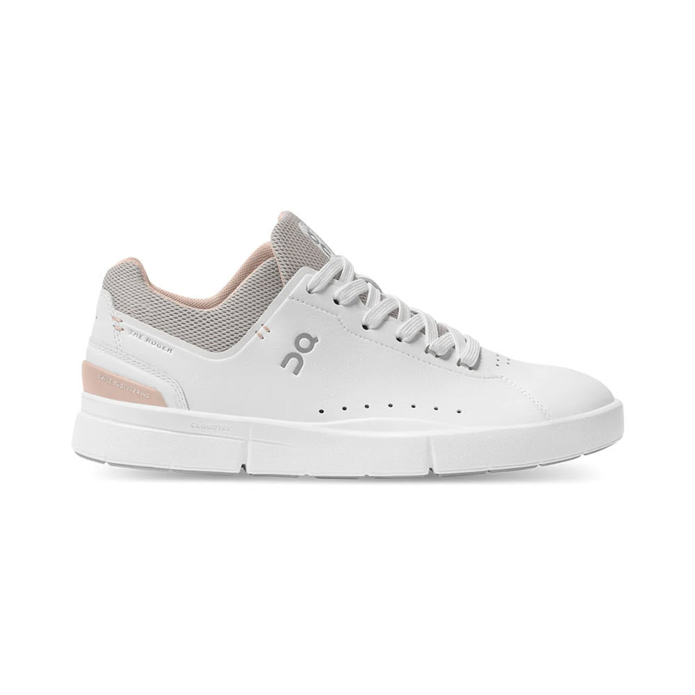 A white low-top sneaker with a gray tongue, beige accents, perforations on the side, and a rubber sole featuring CloudTec® cushioning. Made from vegan leather, this stylish shoe bears the brand logo &quot;On Running&quot; on the side and heel and is inspired by Roger Federer. The product name is ON THE RODGER ADVANTAGE WHITE/ROSEHIP - WOMENS.