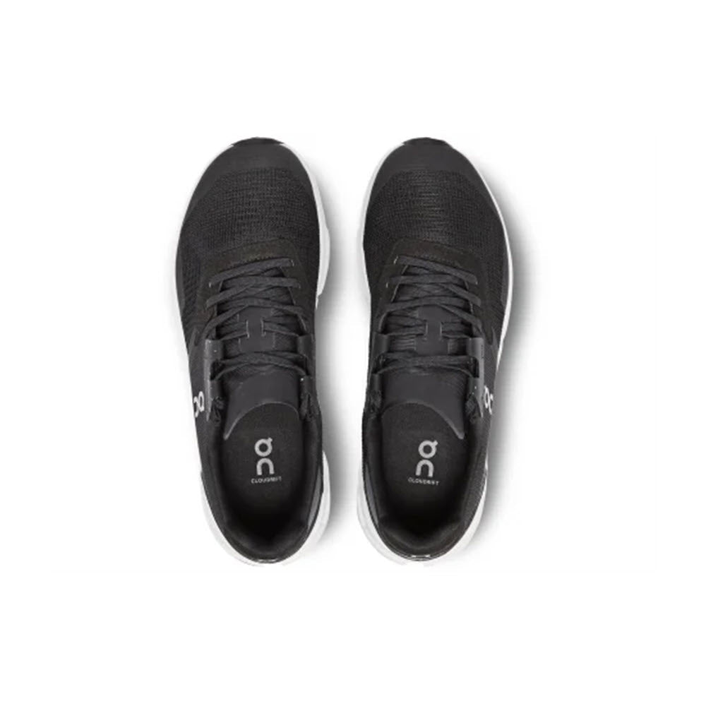 A pair of ON CLOUDRIFT BLACK/WHITE - WOMENS athletic shoes by On Running, featuring breathable mesh, viewed from above.