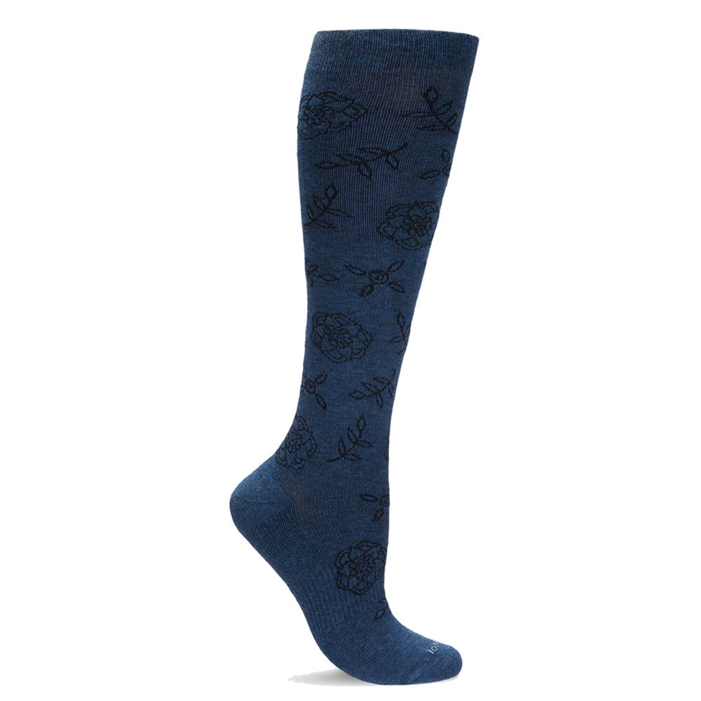 The MEMOI FLORAL COMPRESSION SOCKS 15-20MMHG DENIM - WOMENS by Memoi are knee-high blue socks featuring a black floral pattern and designed with graduated compression to improve blood circulation.