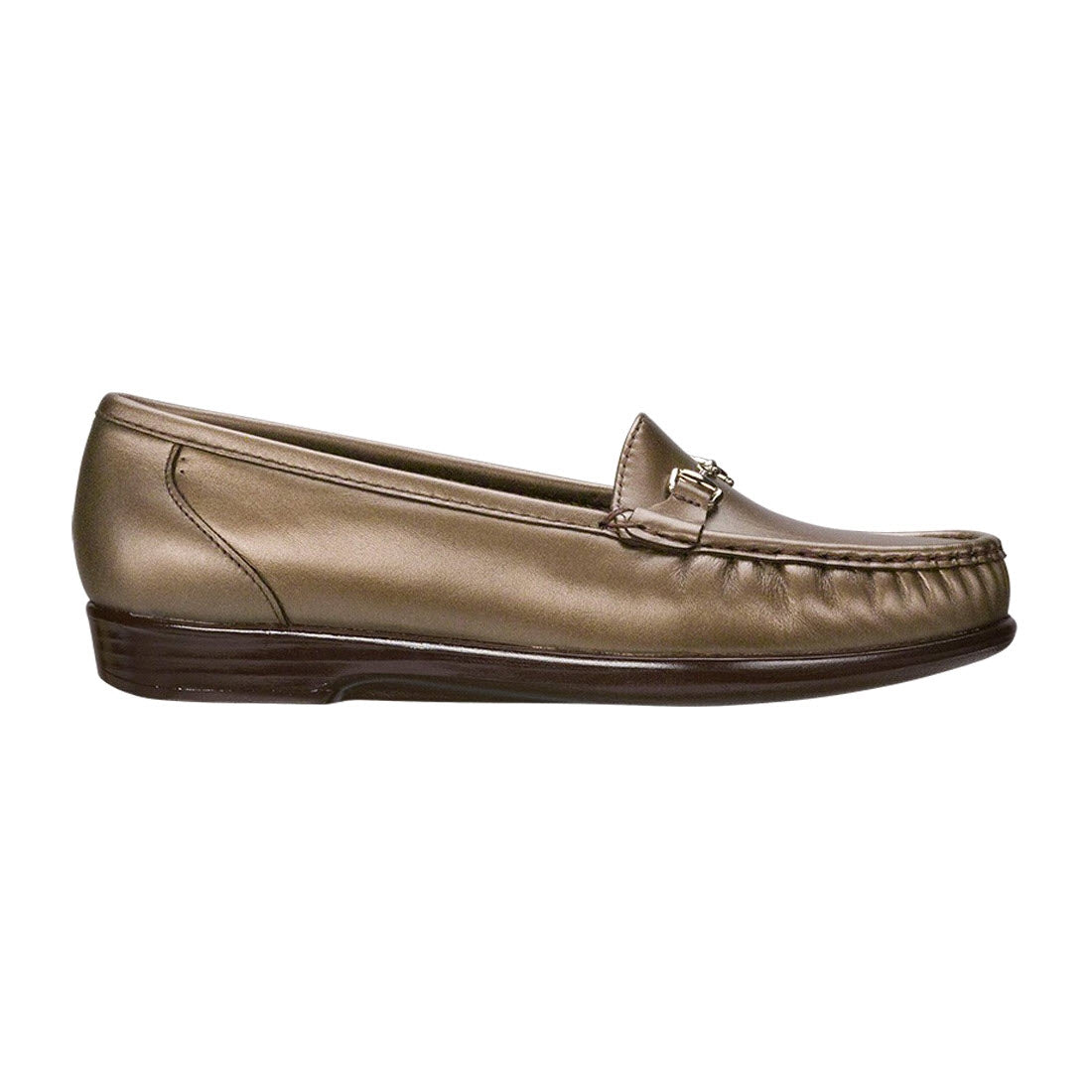 A single SAS METRO BRONZE - WOMENS slip-on loafer in brown leather features a low heel, side stitching, and a small decorative metal buckle on the upper section. Complete with a shock-absorption polyurethane outsole for comfort.