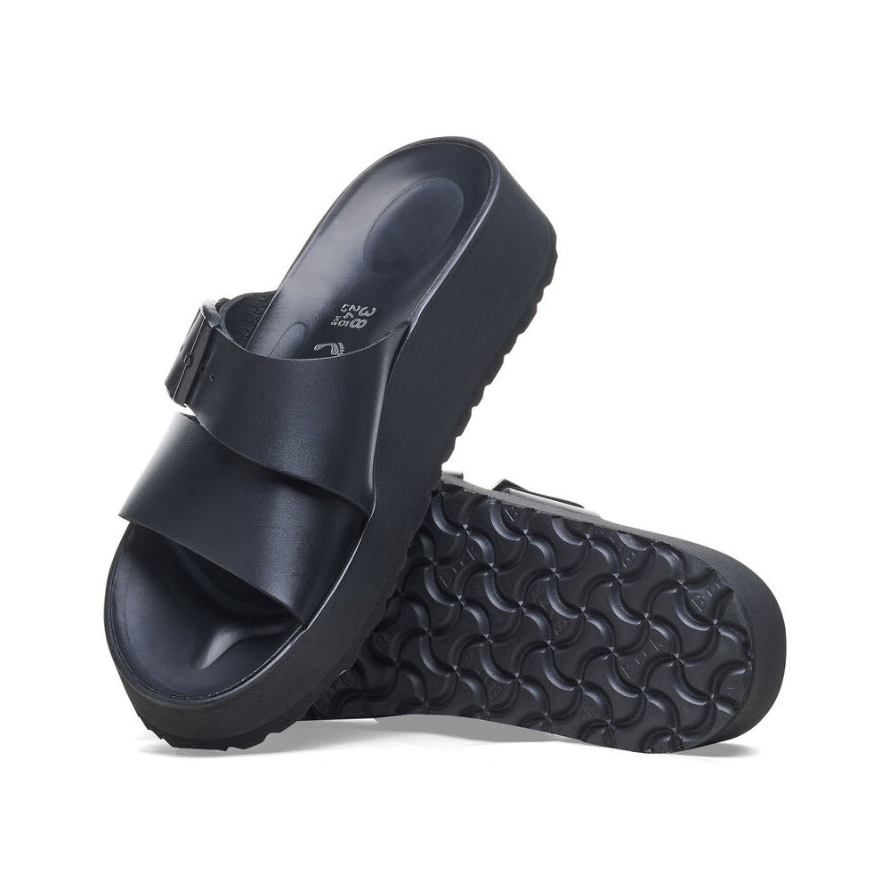 The BIRKENSTOCK ALMINA BLACK - WOMENS by Birkenstock features thick soles, a contoured footbed, and textured tread for ultimate comfort.