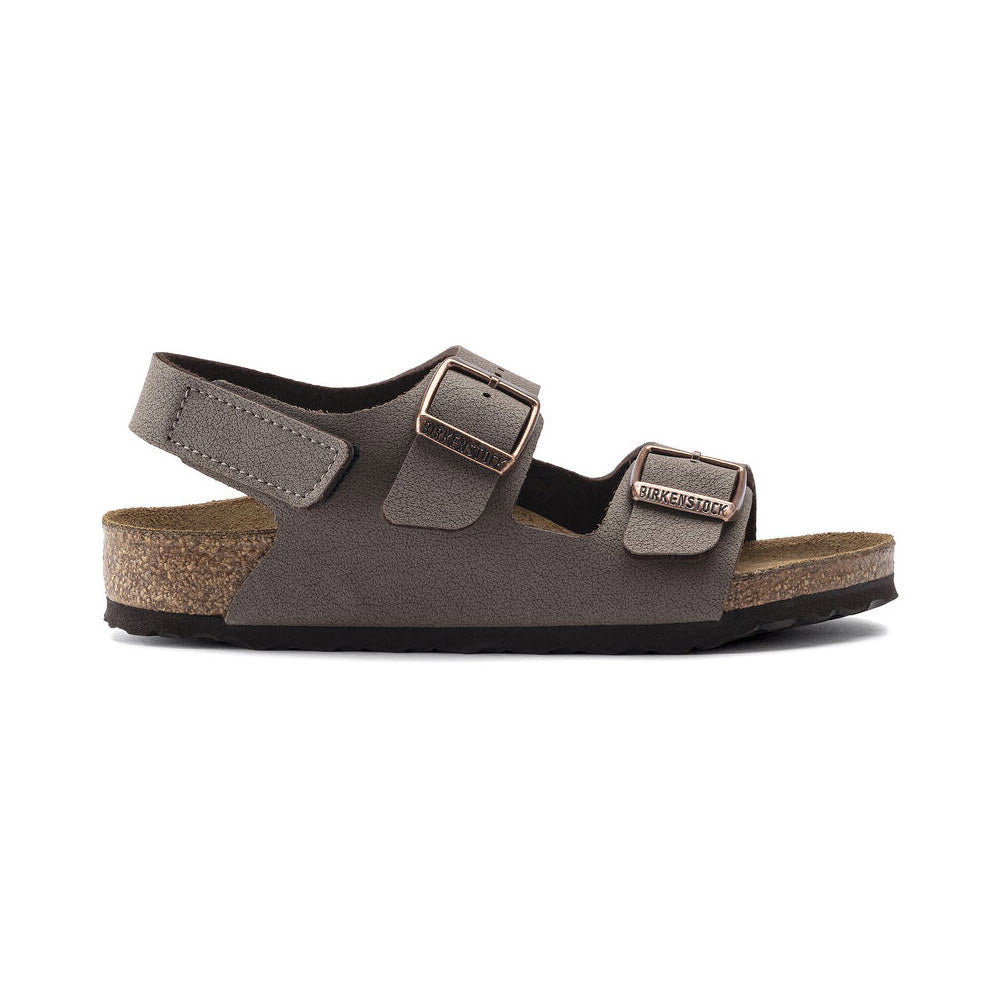 A single gray sandal from the BIRKENSTOCK MILANO HOOK &amp; LOOP MOCHA BIRKIBUC - KIDS range, featuring two adjustable buckle straps and a comfortable cork sole. Ideal for kids&#39; footwear, it seamlessly combines style with practicality.