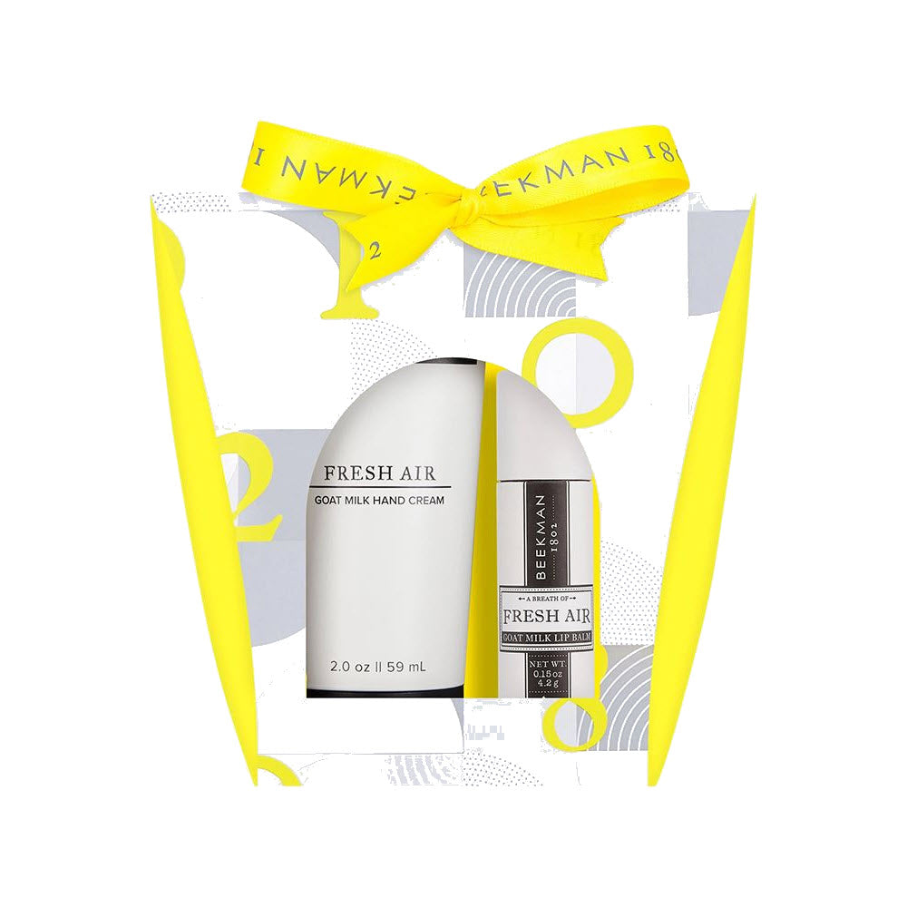 Packaging of BEEKMAN skincare product: BEEKMAN GIFT SET LIP HAND FRESH AIR, designed to hydrate and rejuvenate your skin, displayed with a yellow ribbon.