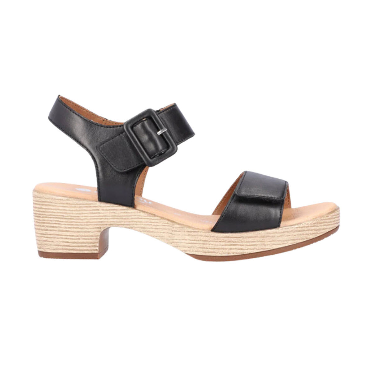 The Remonte REMONTE BLOCK HEEL SANDAL BLACK - WOMENS boasts a black leather upper with a thick heel, adjustable ankle strap with buckle, and a wide toe strap, complemented by a light wood-textured sole.