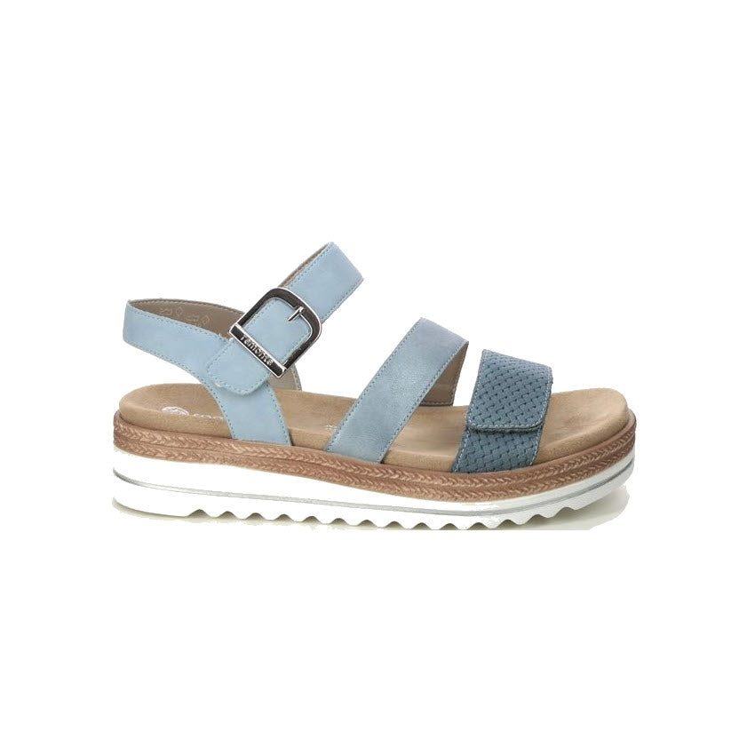 The REMONTE CITY WALKER GLADIATOR SANDAL BLUE for women by Remonte features three straps, a buckle, and a platform sole. The lightweight white sole has a brown layer in the middle and is designed to be shock-absorbing for ultimate comfort.