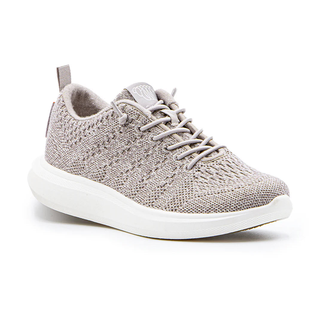 A single Woolloomooloo Coogee Natural - Adults sneaker, featuring a light gray Merino Wool upper with a white sole and gray laces, is shown against a plain background, offering orthopedic support.