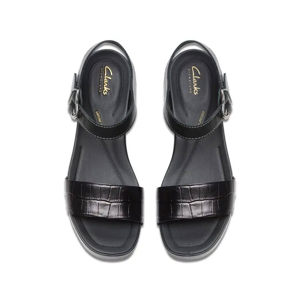 A pair of CLARKS SIVANNE BAY BLACK - WOMENS sandals featuring adjustable ankle straps, butter-soft black leather uppers, and a luxurious Contour Cushion footbed from Clarks.